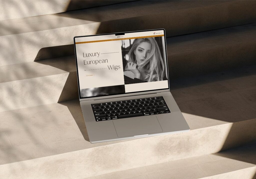 website of devwig on laptop on stairs